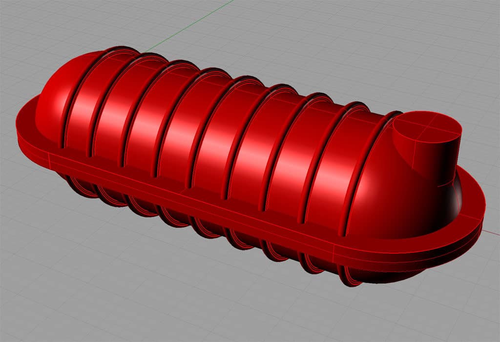 Red elongated object with ridged sides and cylindrical protrusion.