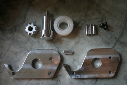 Metal parts: gears, washers, machine components.