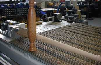 Fourth axis milling head on a CNC machine.