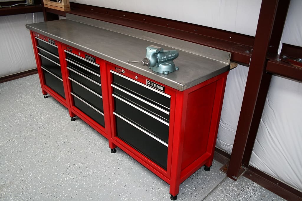 A red tool cabinet, also known as a toolbox, in a garage.