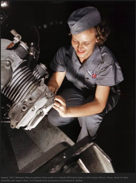 Woman in gray uniform working on Wright Whirlwind motor, Corpus Christi Naval Air Base, August 1942
