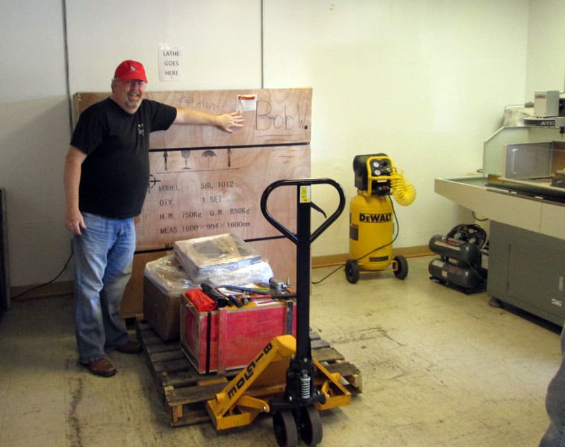 bob unloading a machine with a palette jack