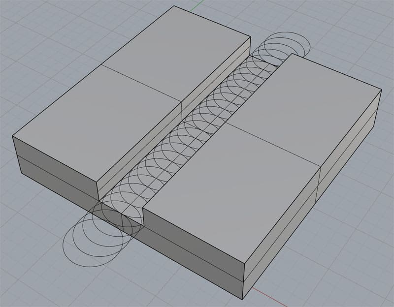 Two rectangular blocks with a spiral groove in their intersection.