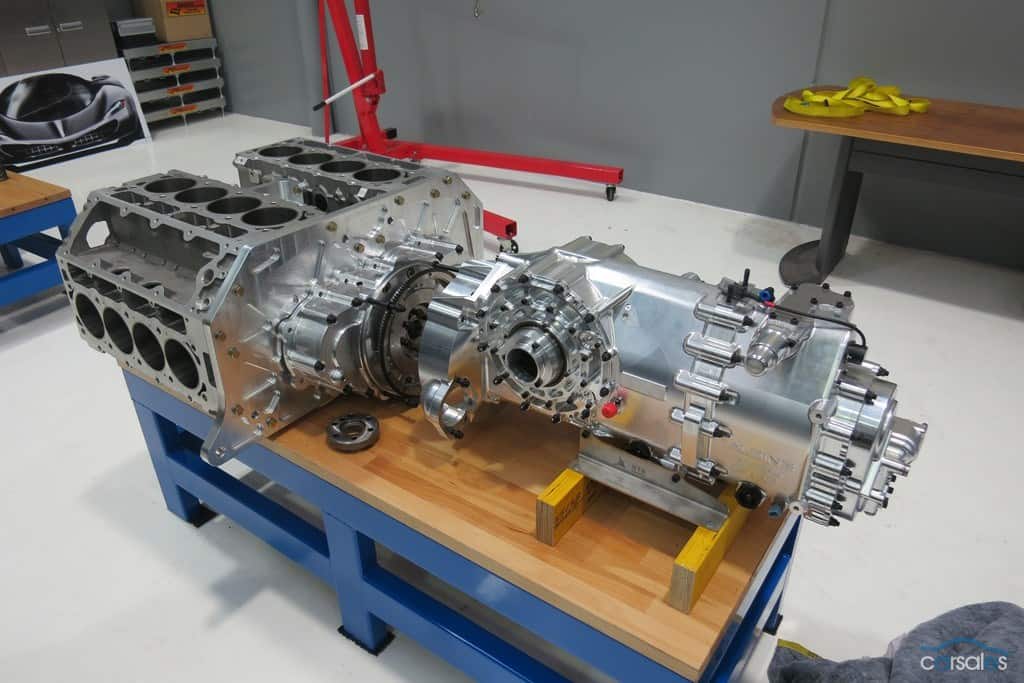 A Go Fast engine is sitting on a table in a workshop.