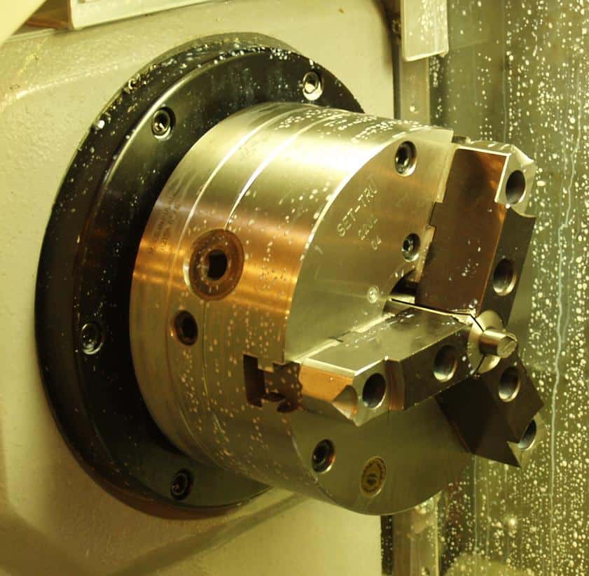 A cnc machining center with a cnc lathe equipped with 5C Collet Chuck.