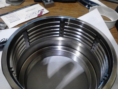 A stainless steel container with cnc tools.