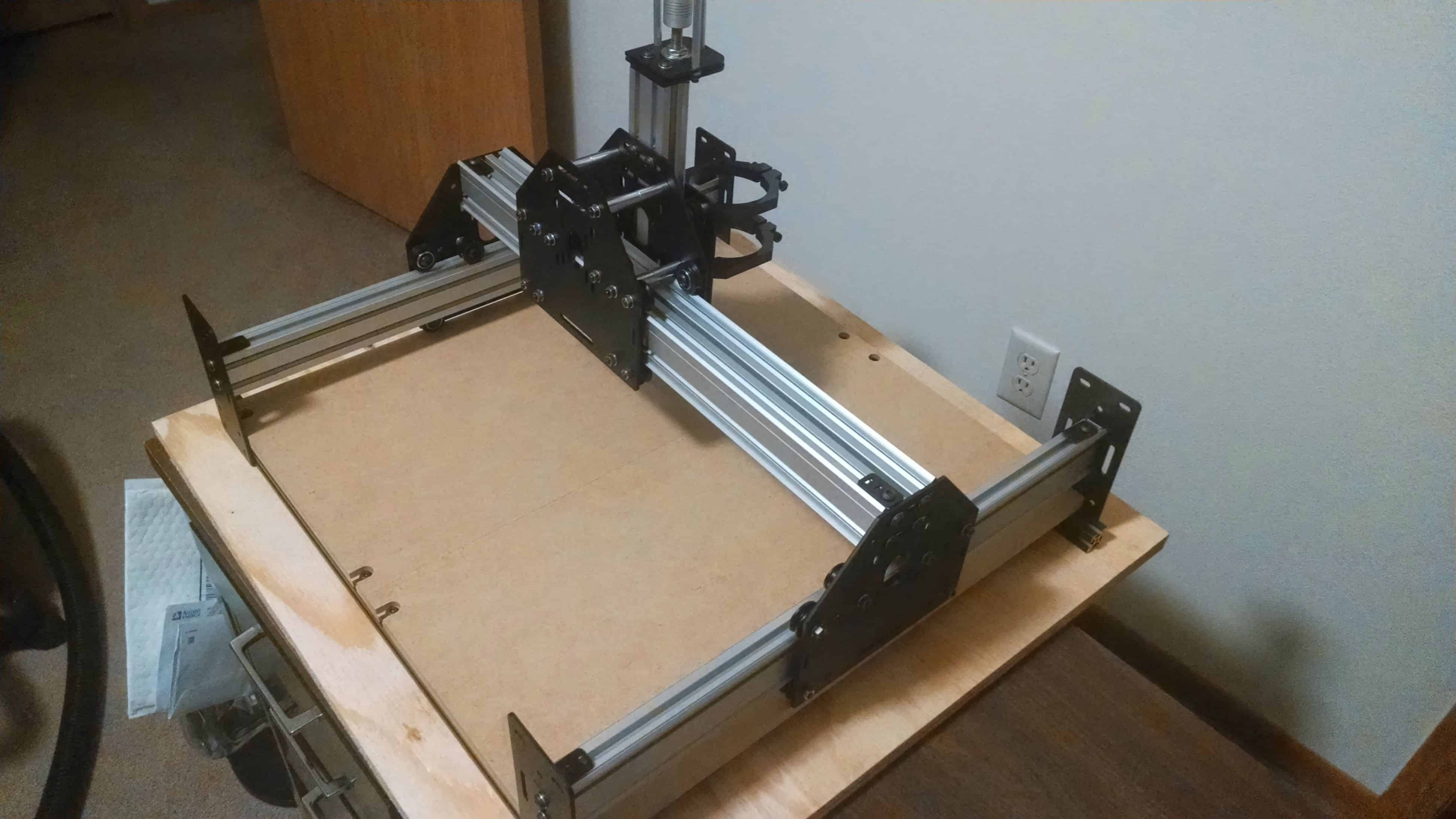 This CNC router goes a long way on top of a wooden table.