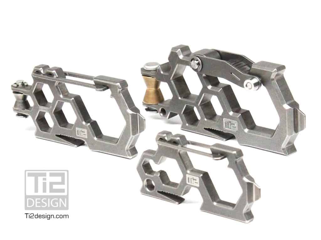 Titanium Ti2 Design carabiners on a metal background.