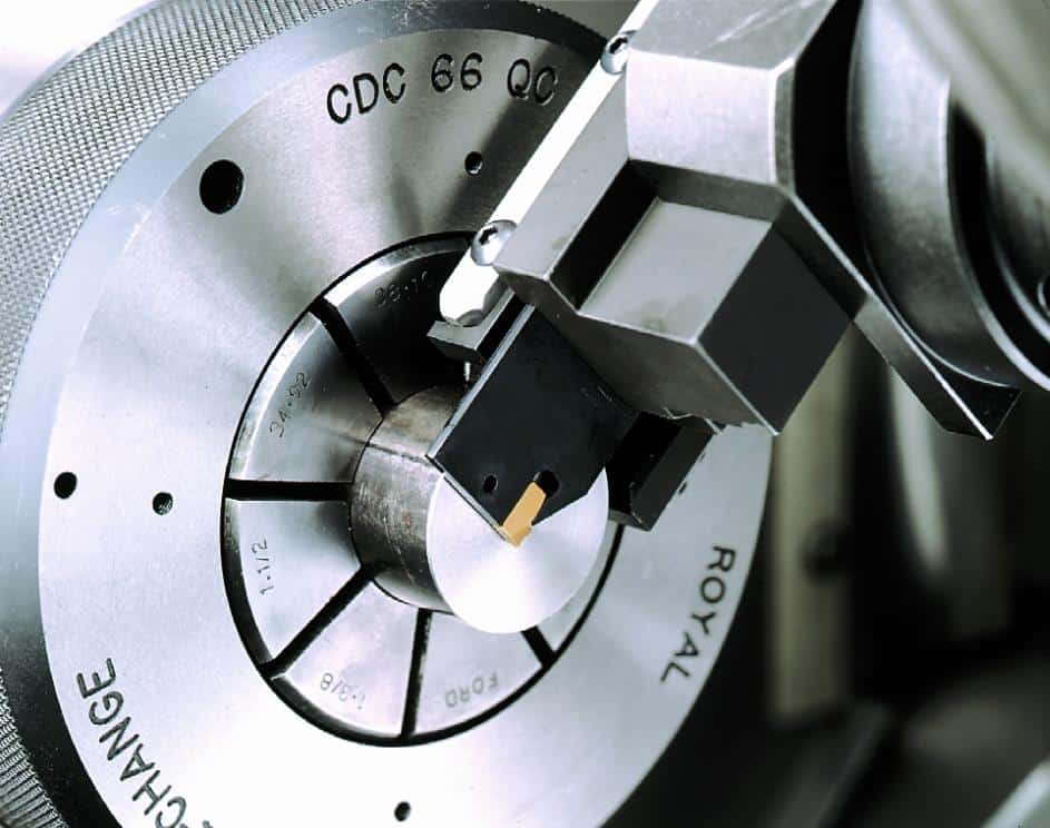 A close up of a machine with a piece of metal on it, designed to save time and money.