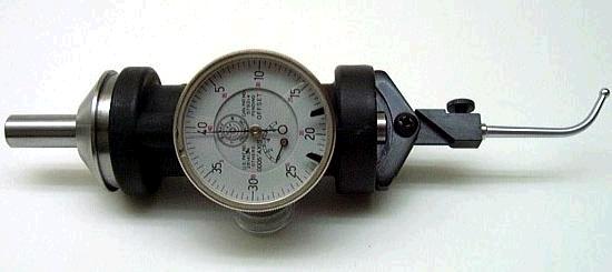 A coaxial indicator with a dial attached to it.