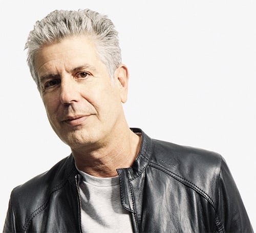 Renowned chef and author Anthony Bourdain in a black and white portrait.