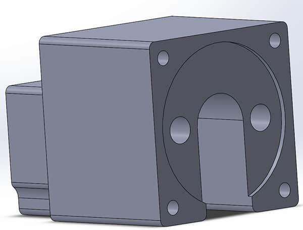 A rectangular object with rounded corners and a circular cutout on one side, featuring four evenly spaced holes.