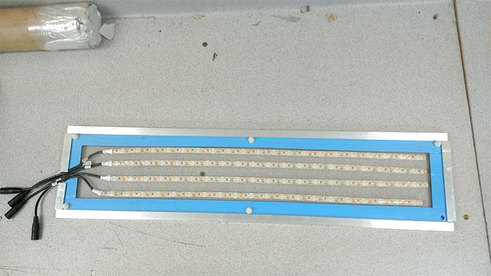 A blue LED panel, perfect for Tormach CNC Lathe projects, featuring durable waterproof wiring.