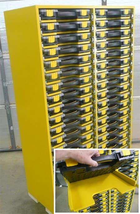 A yellow cabinet with multiple drawers and small plastic containers inside.