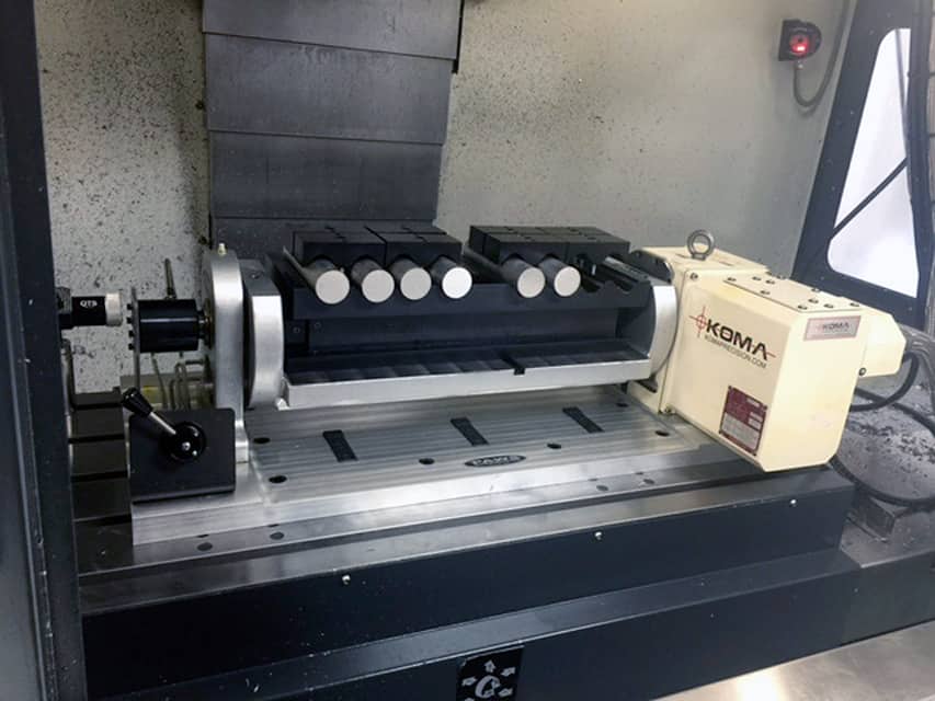 Fourth axis fixture for round stock