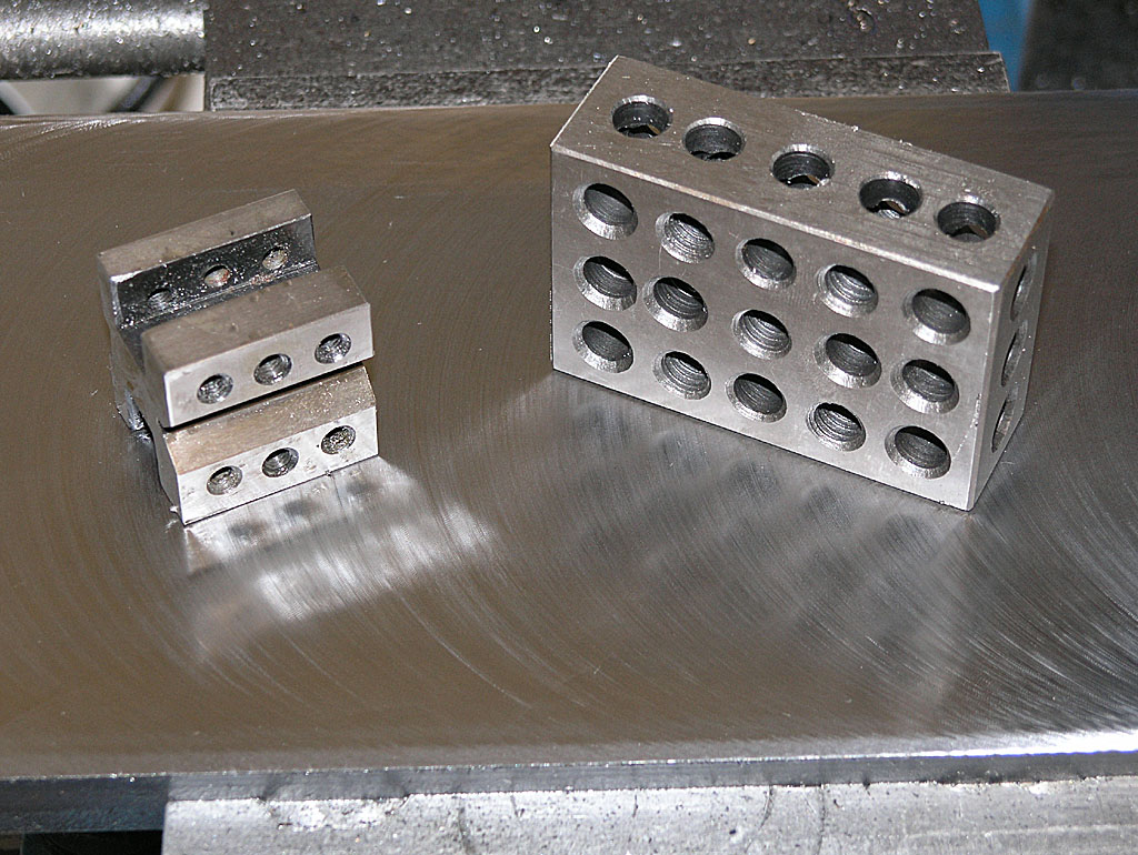 Metal block with multiple drilled holes.