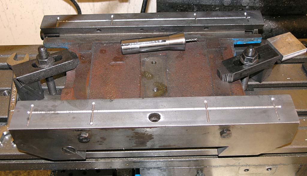 Machinery on a workbench for machining or metal fabrication.