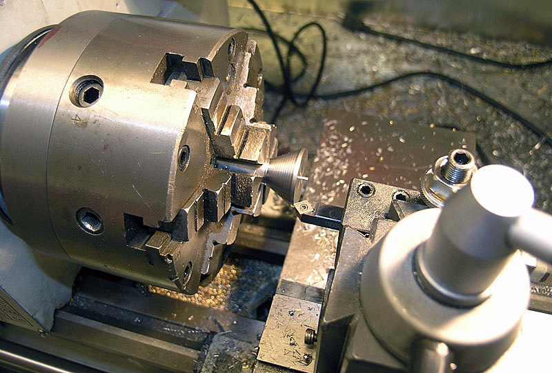 A lathe with cutting tool in place, showcasing metal fabrication precision.