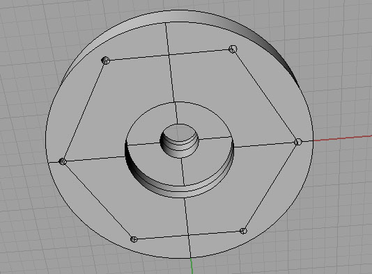A circular metal backplate with a central hole and four evenly spaced holes on its circumference.
