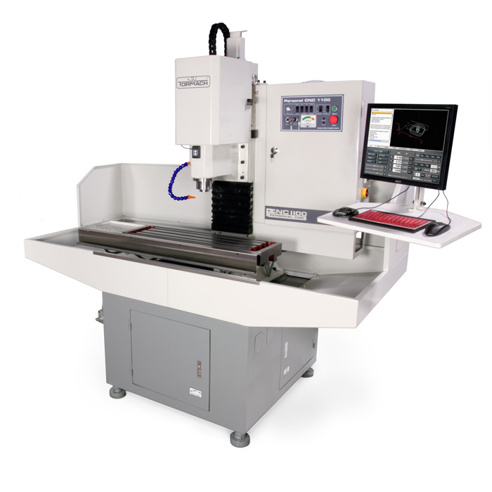 Tormach PCNC 1100 Series 3 CNC milling machine with computer equipment.