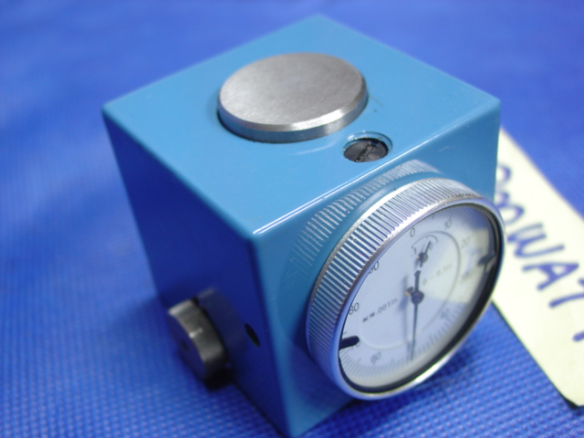 Small blue device with silver knob and round dial for machining or metal fabrication use.