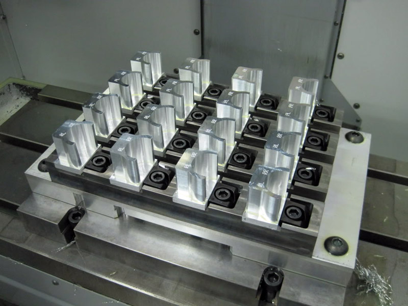 Metal pallet with 25 clear acrylic blocks in grid pattern.