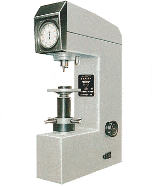 A calculator-like machine with a clock on it that can perform hardness conversion tests.