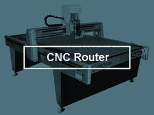 Large flat table with robotic arm above, used for machining and precision cutting.
