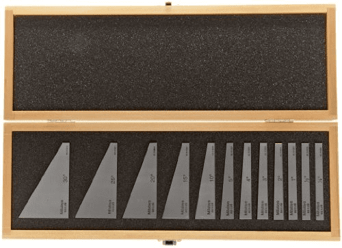 Precision metal rulers in a wooden case.