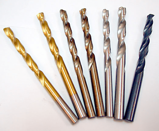 Five different types of holemaking drill bits on a white surface.