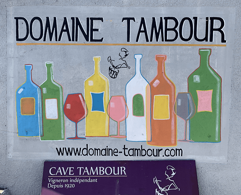 Colorful illustration of wine bottles and glasses on a machining website.