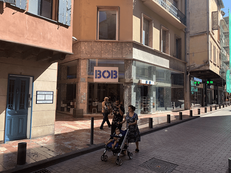 Bustling city street scene with old and new architecture