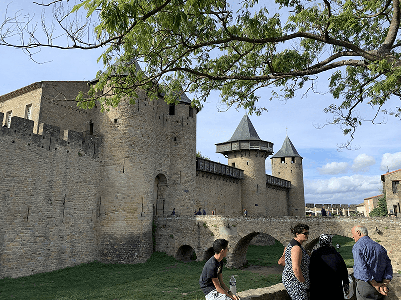 Medieval fortress with stone walls and towers.