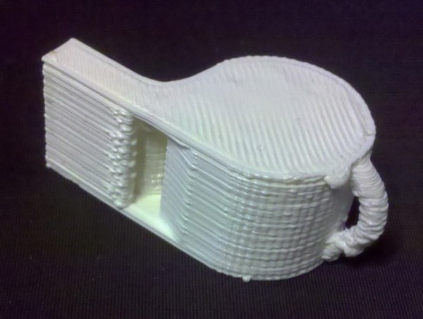 A diy cnc machine created a 3d printed model of a guitar.