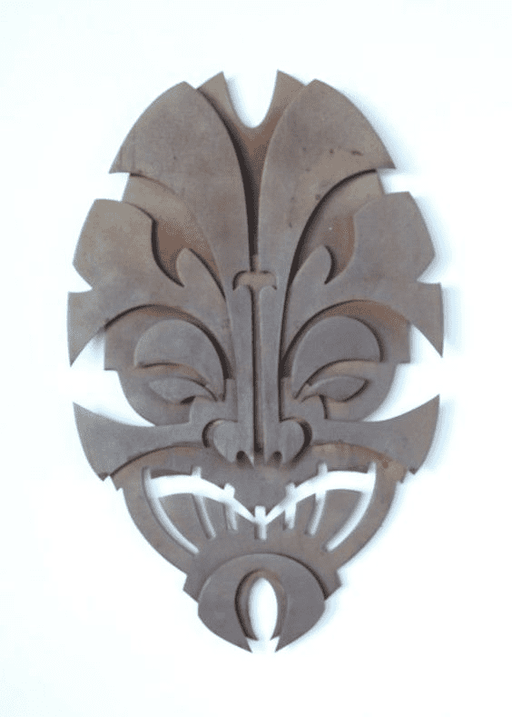 A stylized abstract design featuring a face-like motif, prominent nose and eyes, set against a white background, possibly a logo for CNCCookbook.com.