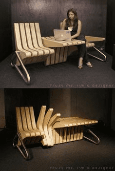 Woman sitting at a laptop on an unusual chair with a built-in desk.