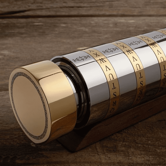 Telescope with brass-colored finish and Roman numerals on a wooden table.