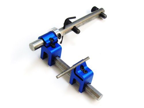 A pair of blue metal clamps on a white background, resembling machinist vise.