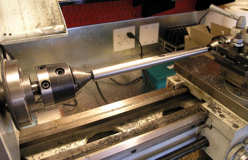 Metalworking lathe with metal shavings.