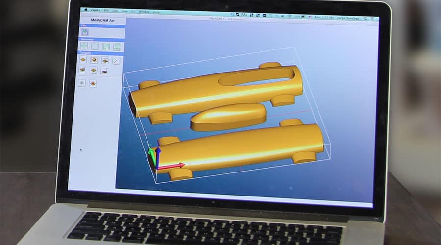 A laptop screen displaying a 3D model of a car body part in gold on a blue background.