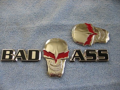 Two badass skull emblems on a blue cloth.