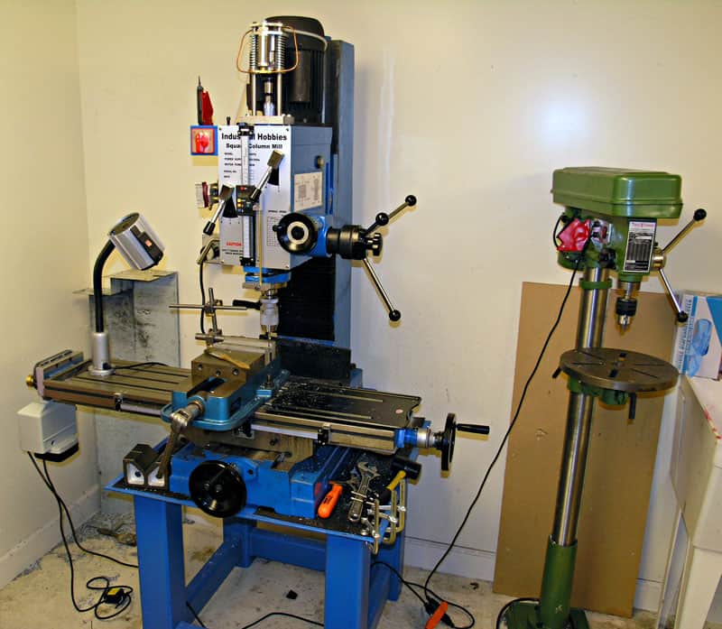 A blue milling machine enhanced with DIY Drill Press Guide.