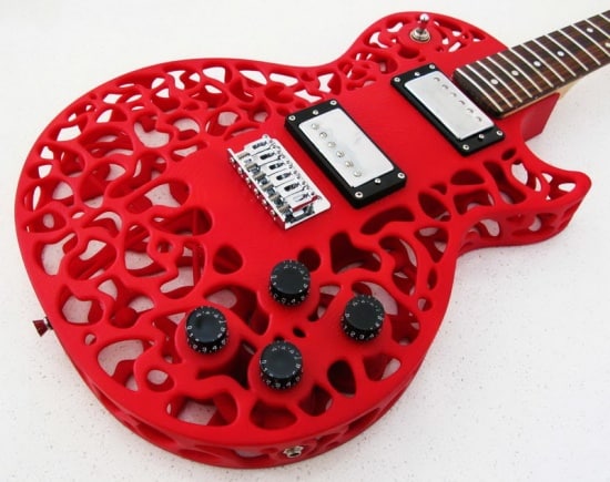 A red electric guitar made out of 3d printed parts.