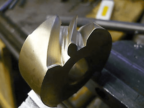 Metal object with a curved shape.