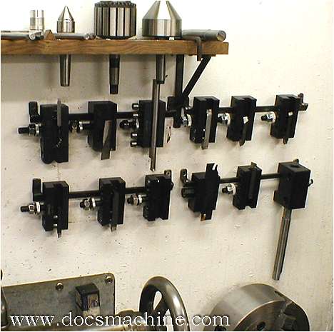 Metal parts on a wall in a machine shop setting.