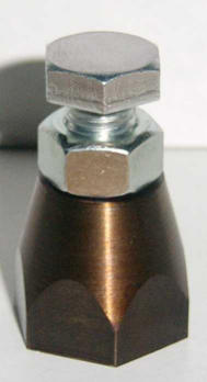 Hexagonal nut with silver head and brown conical base.