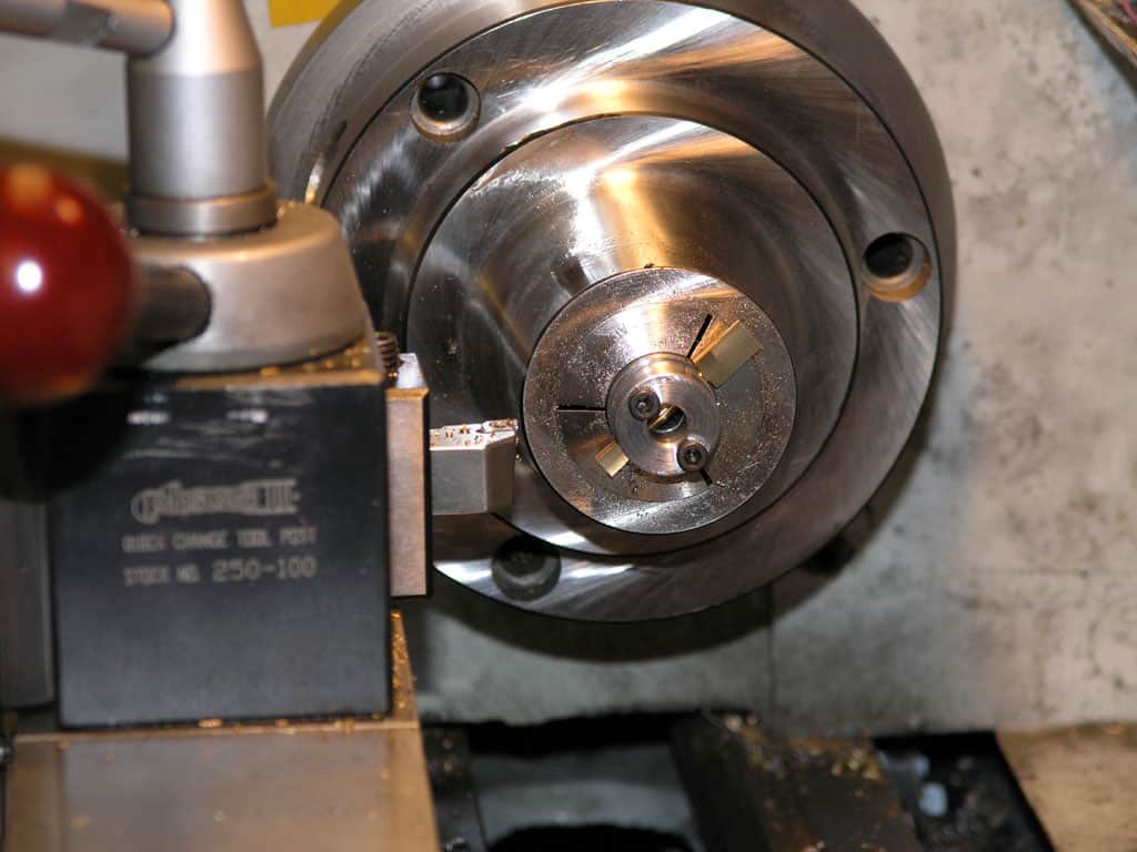 Close-up view of a metal lathe's internal components.
