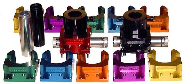 Colorful anodized metal parts on a CNC milling machine.