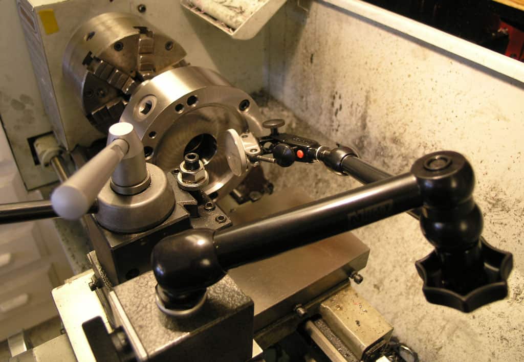 Lathe machine with tools and components.