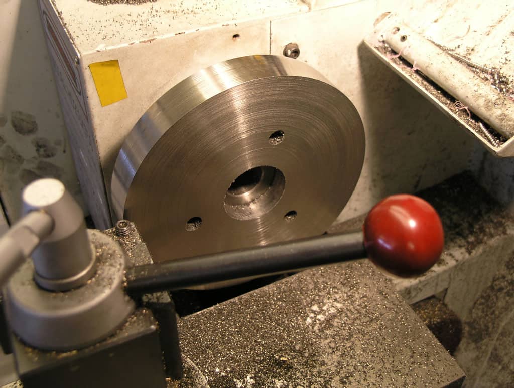 Metal cutting lathe spindle chuck with large diameter and smooth surface.